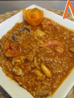 Una foto de Arroz meloso a la naranja