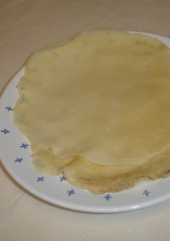 Una foto de Crêpes rellenos de espinacas con jamón