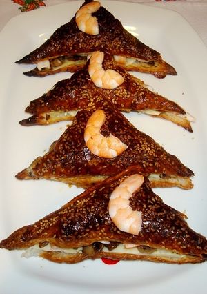 Una foto de Mil hojas de langostinos y champiñones