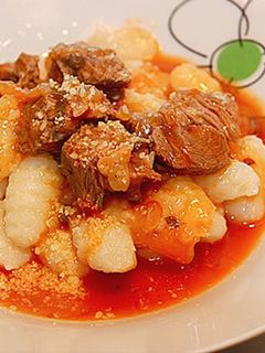 Una foto de Ñoquis de papa con salsa boloñesa