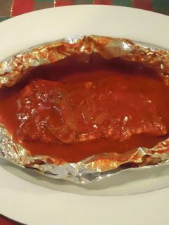 Una foto de Filetes empapelados al achiote