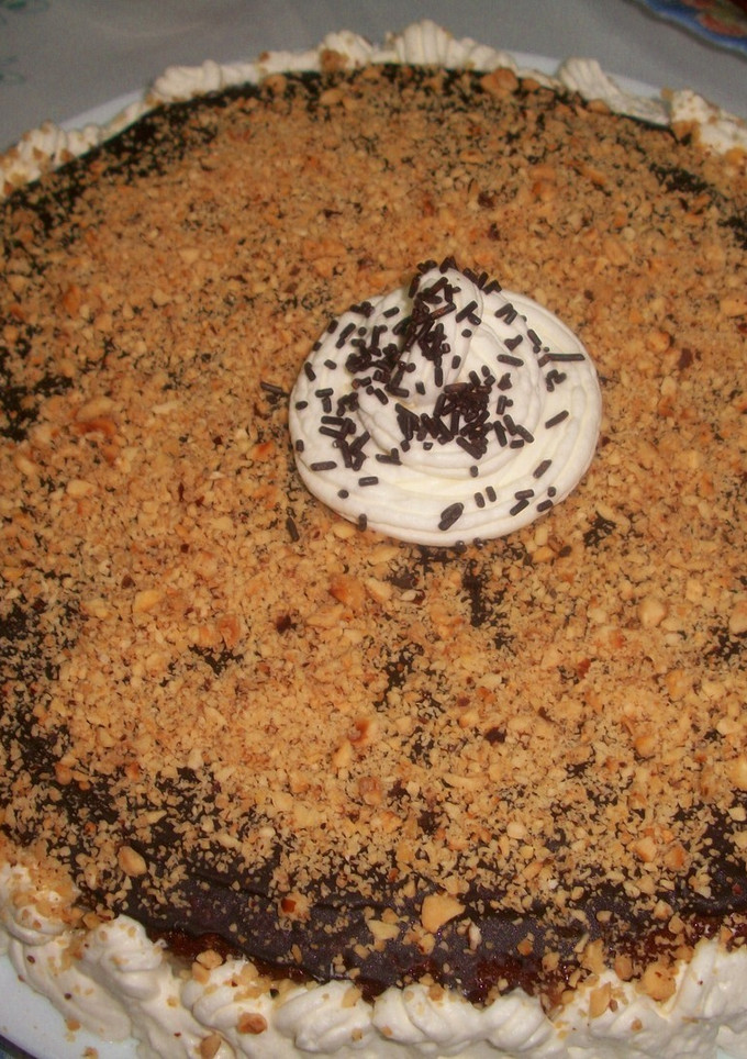 Una foto de Tarta al cava con crema de limón y cobertura de chocolate