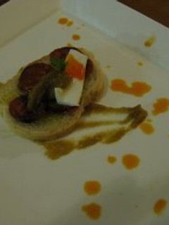 Una foto de Pan con chorizo y cebolla caramelizada