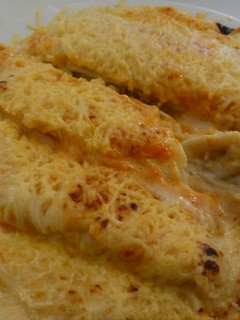 Una foto de Canelones de gambas y cigalas