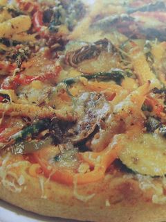 Una foto de Pizza integral vegetariana