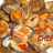 Patatas con chipirones y almejas