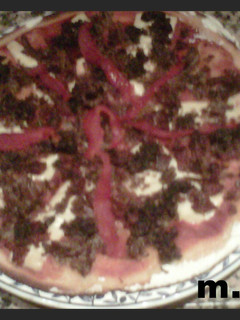 Una foto de Pizza de cocido