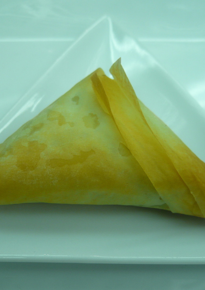 Una foto de Triángulos de espinacas y queso