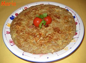 Una foto de Tortilla de habas con cabecero de lomo