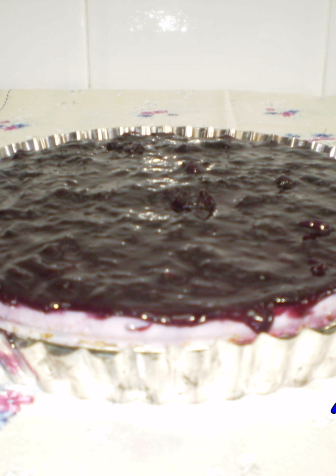 Una foto de Tarta de queso crema light con arándanos