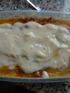 Una foto de Polenta con salsa de panceta y hierbas