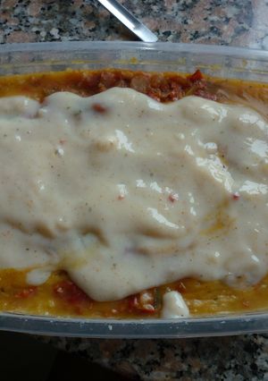Una foto de Polenta con salsa de panceta y hierbas