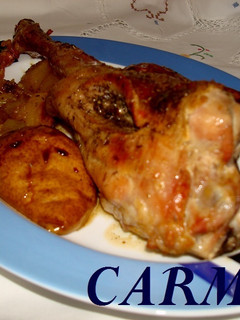 Una foto de Cabrito al horno con patatas y peras al vino
