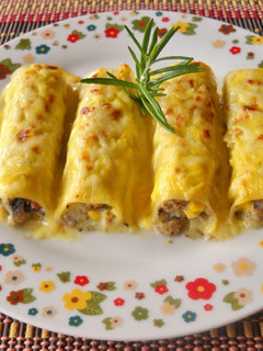 Una foto de Canelones con bechamel de zanahoria y cúrcuma