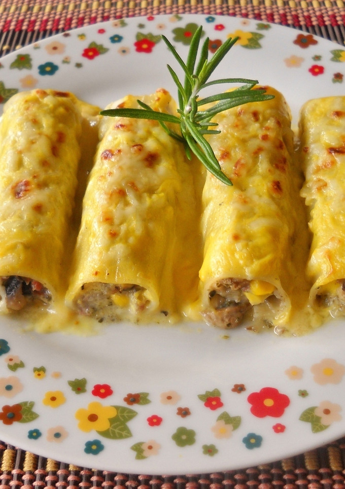 Una foto de Canelones con bechamel de zanahoria y cúrcuma