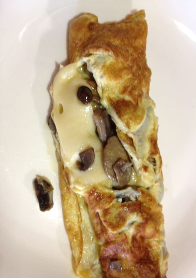 Una foto de Tortilla de champiñones y queso