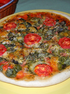 Una foto de Pizza con canónigos