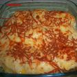 Bolitas de puré de patatas rellenas de atún y gratinadas
