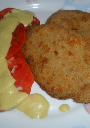 Una foto de Milanesas de peceto con tomate en mostaza