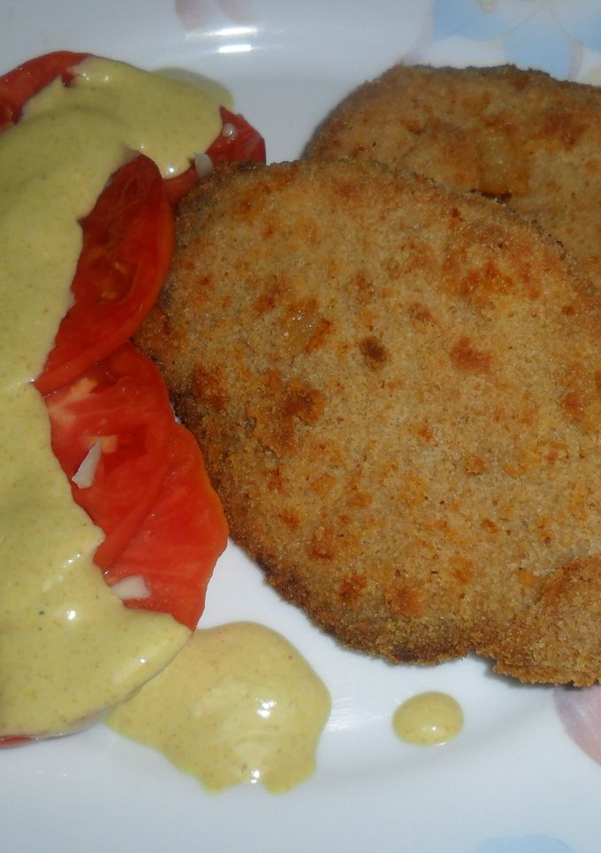 Una foto de Milanesas de peceto con tomate en mostaza