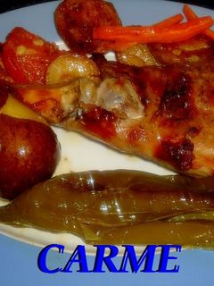 Una foto de Cabrito al horno con pimientos y patatas asadas