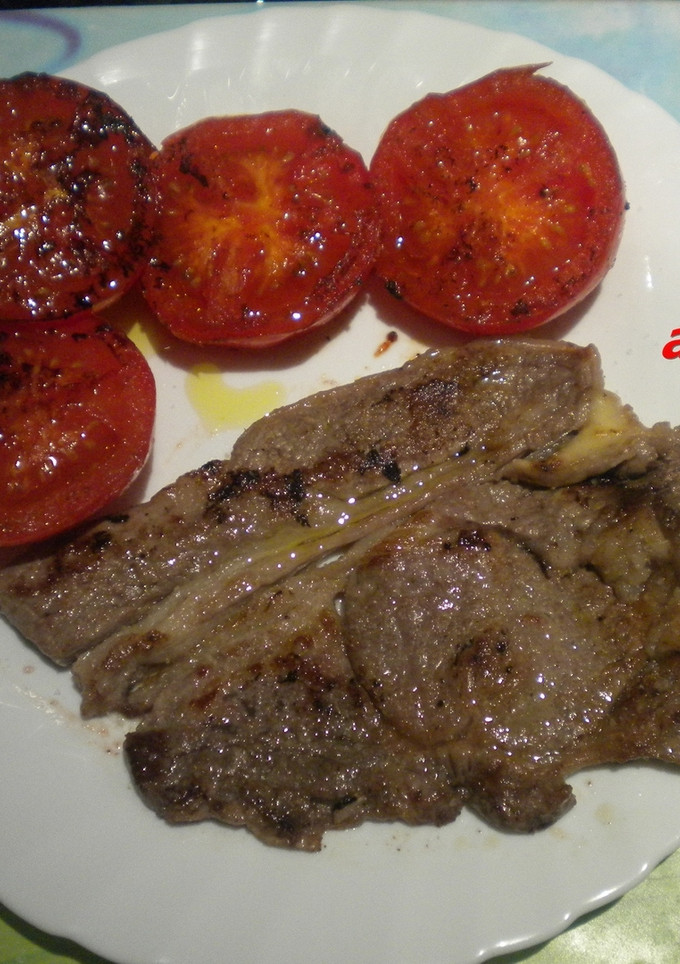 Una foto de Michana con tomates fritos