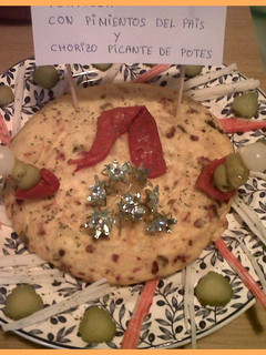 Una foto de Tortilla de pimientos del país y chorizo picante de potes