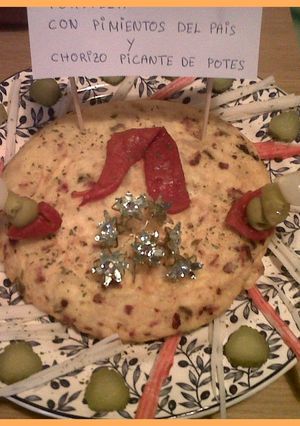 Una foto de Tortilla de pimientos del país y chorizo picante de potes