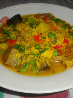 Una foto de Arroz caldoso con cerdo y verduras