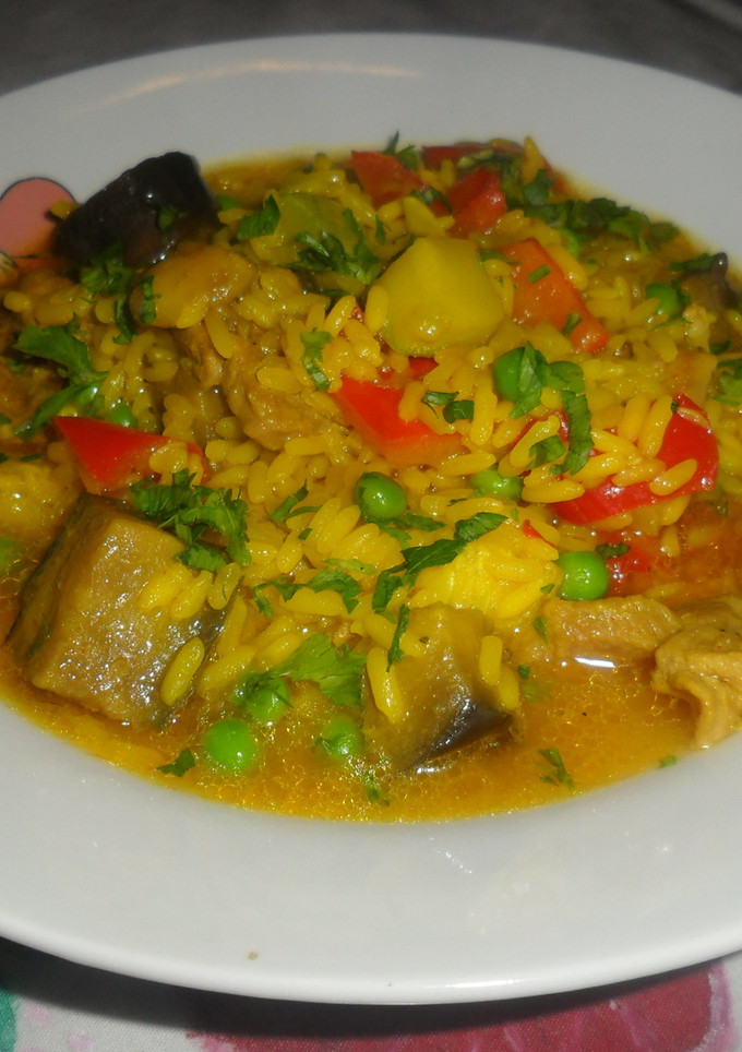Una foto de Arroz caldoso con cerdo y verduras