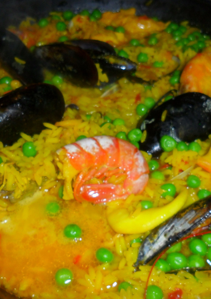 Una foto de Arroz al curry con mariscos