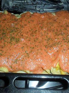 Una foto de Canelones de crema de choclo con salsa de tomate