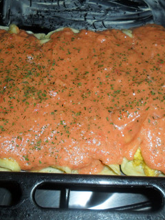 Una foto de Canelones de crema de choclo con salsa de tomate