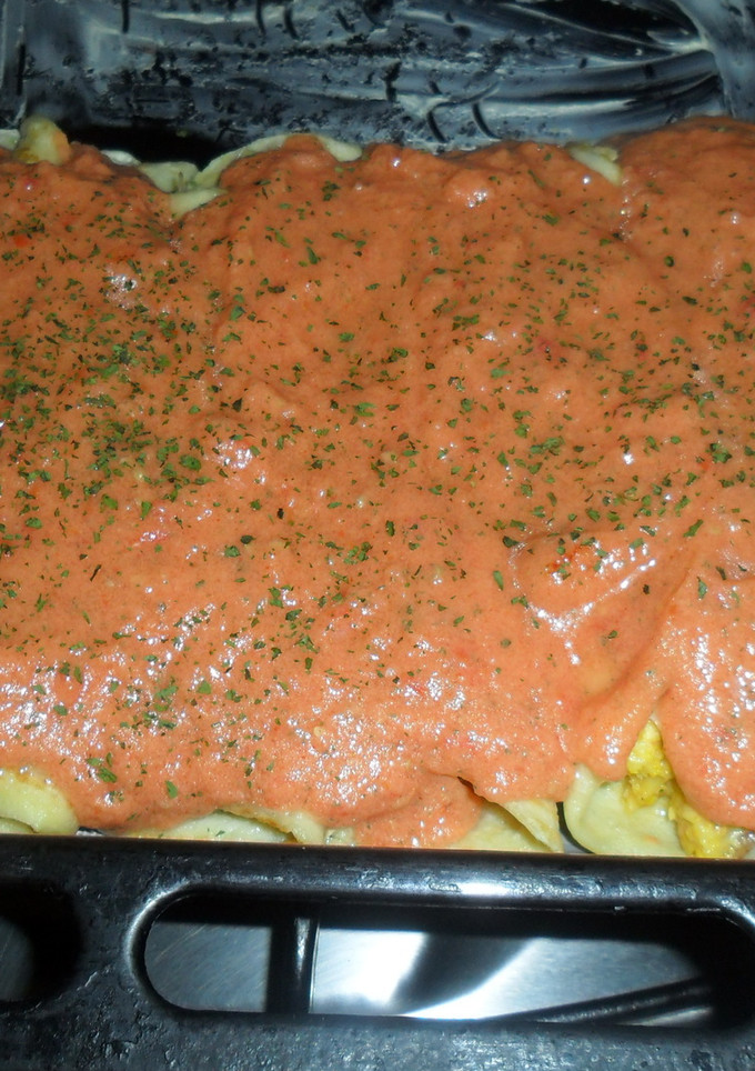 Una foto de Canelones de crema de choclo con salsa de tomate