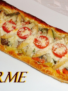 Una foto de Bandas de hojaldre vegetarianas al parmesano