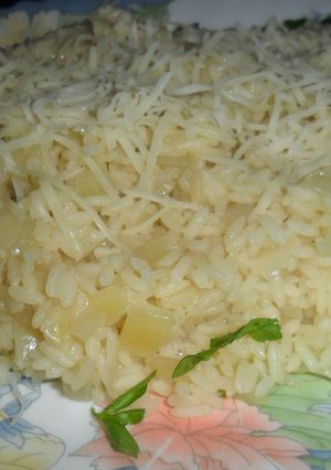 Una foto de Rissotto con grana padano rallado
