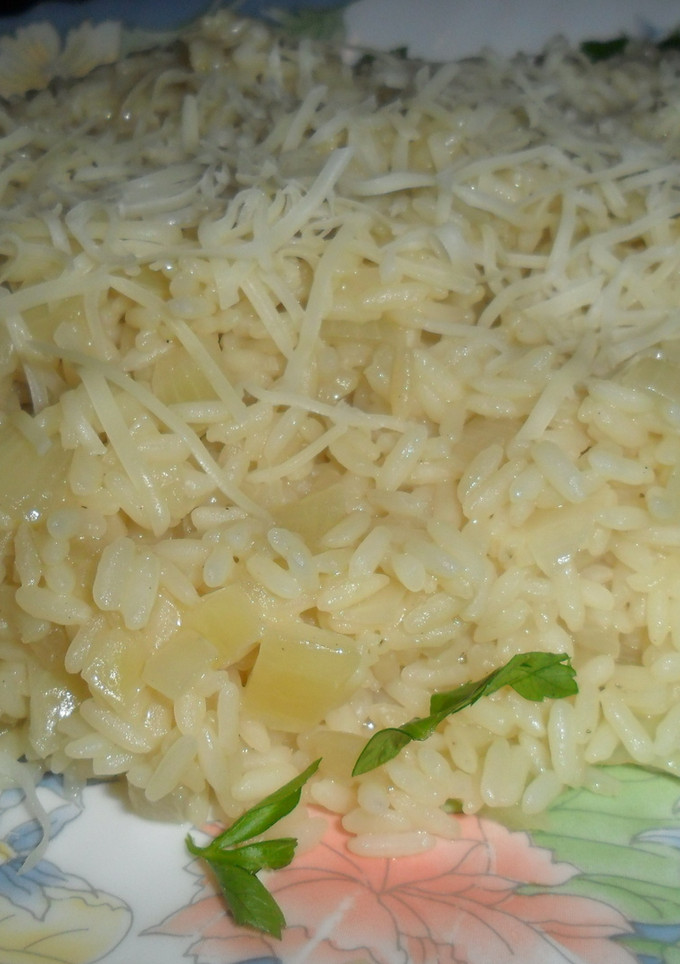 Una foto de Rissotto con grana padano rallado