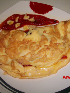 Una foto de Tortilla con pimientos asados