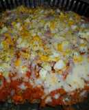 Pizza de carne con jamón y queso