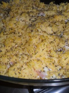 Una foto de Pastel de polenta con jamón y queso