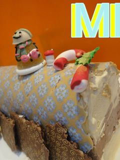 Una foto de Bûche de Noël de biscuit y trufa