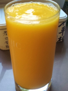 Una foto de Batido de mango, pera y naranja