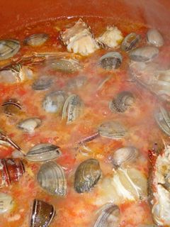 Una foto de Arroz con langosta y almejas