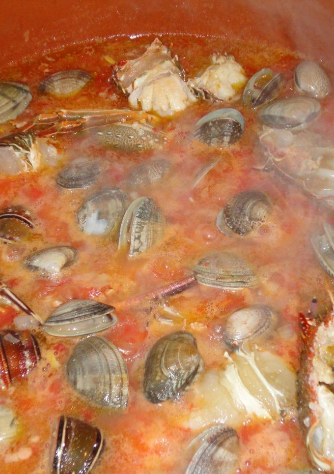 Una foto de Arroz con langosta y almejas