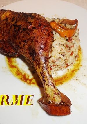 Una foto de Pato confitado al aroma de canela y naranja