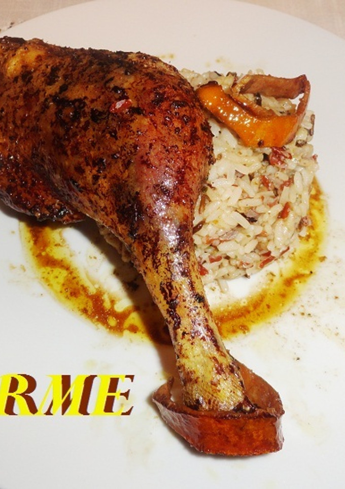 Una foto de Pato confitado al aroma de canela y naranja