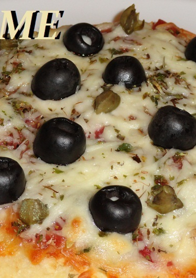 Una foto de Pizzetta de jamón ibérico y beicon