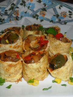 Una foto de Caracolas rellenas de pisto de verduras