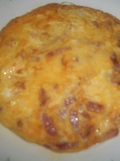 Una foto de Tortilla de bacón y queso emmental