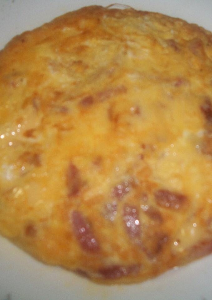 Una foto de Tortilla de bacón y queso emmental